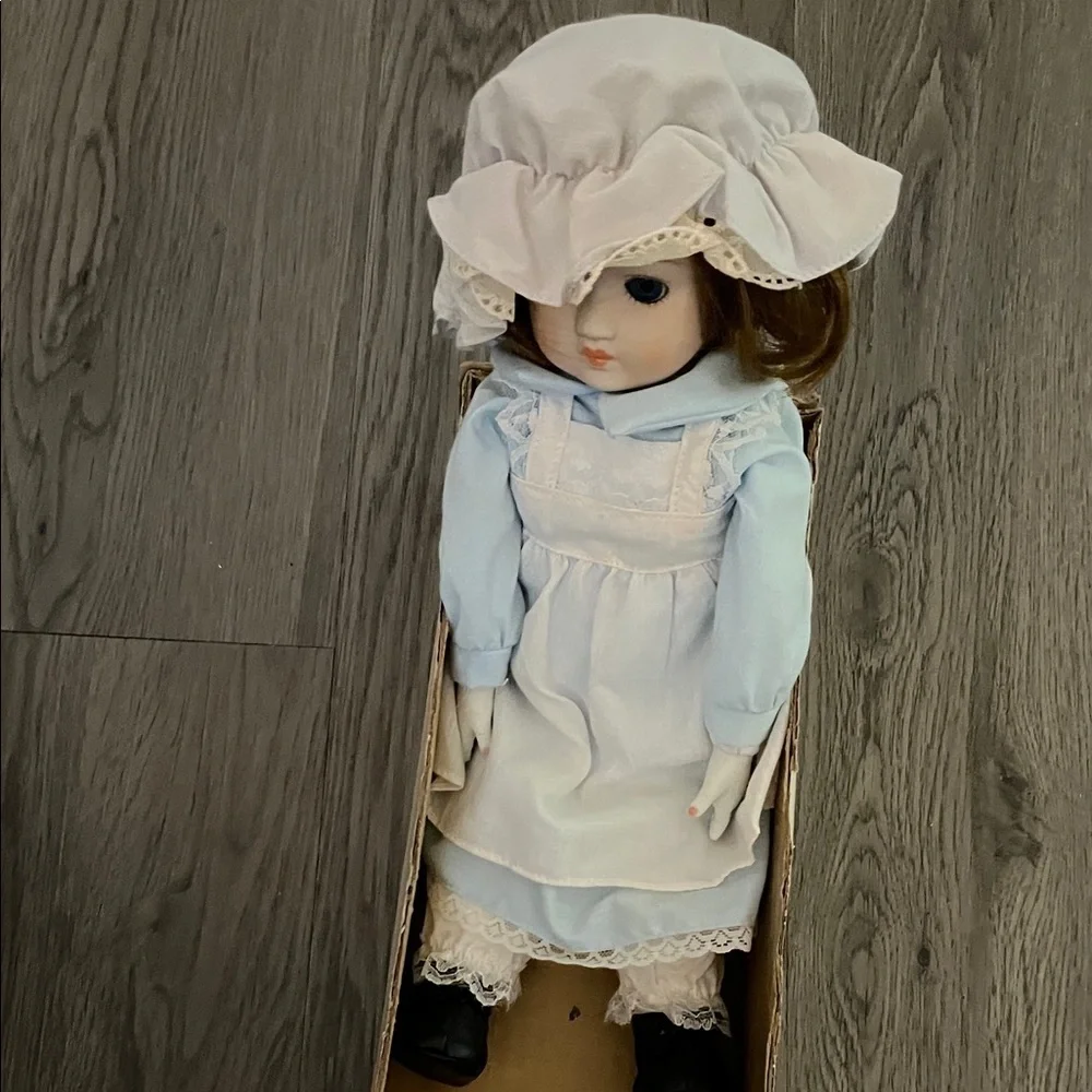 Elegant Blue and White Doll with Bonnet